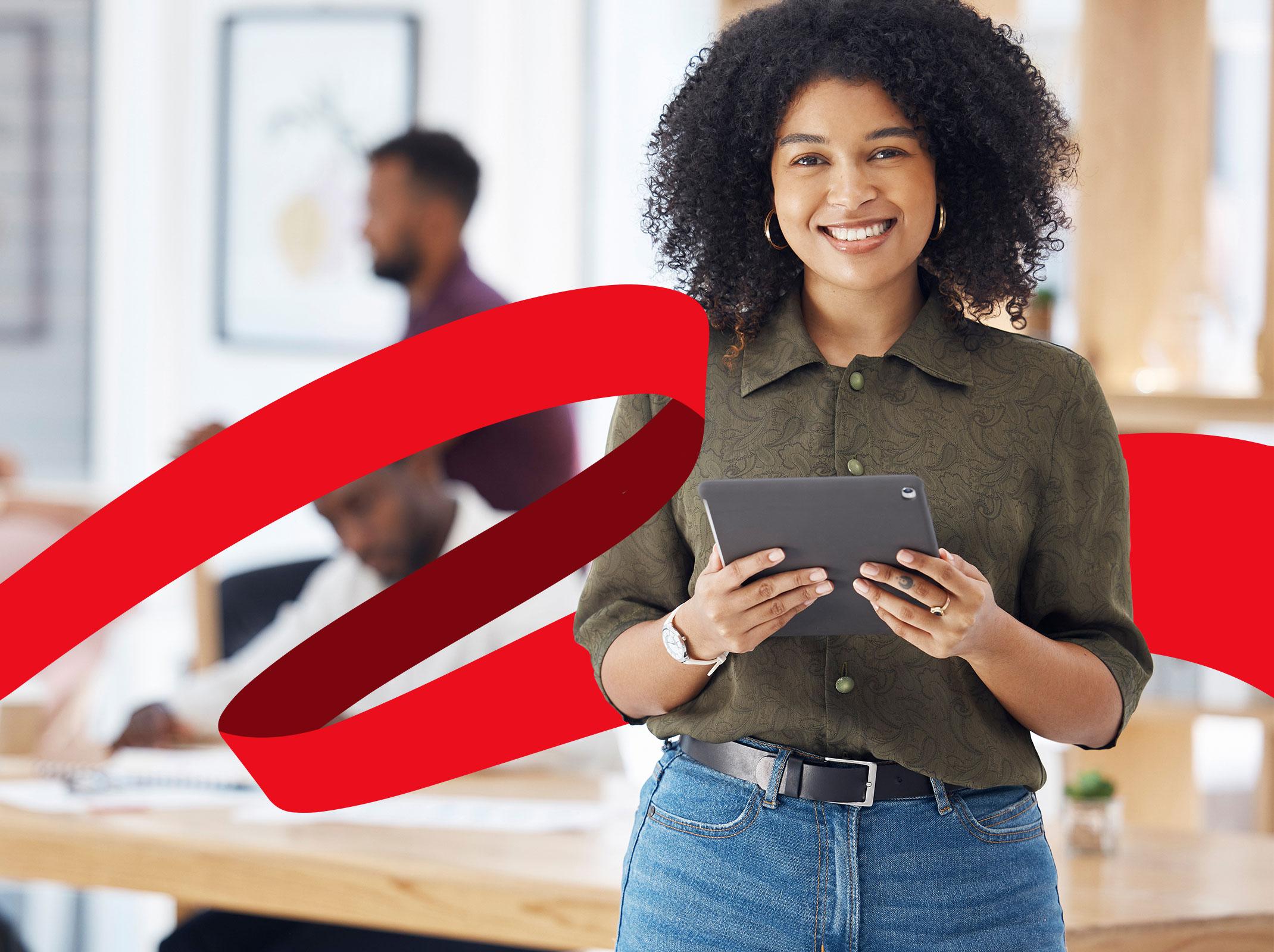 Administrative Professional holding tablet at work 
